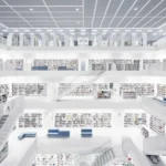 Interior of a modern public library with tall bookshelves