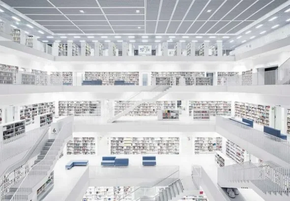 Interior of a modern public library with tall bookshelves
