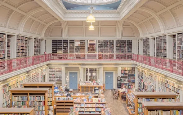 Interior of a public library with tall bookshelves