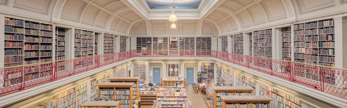 Interior of a public library with tall bookshelves